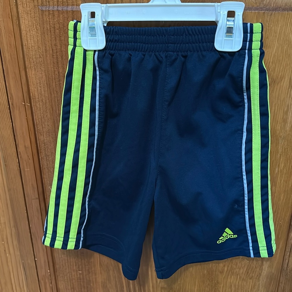 Navy blue shorts with green side stripes
